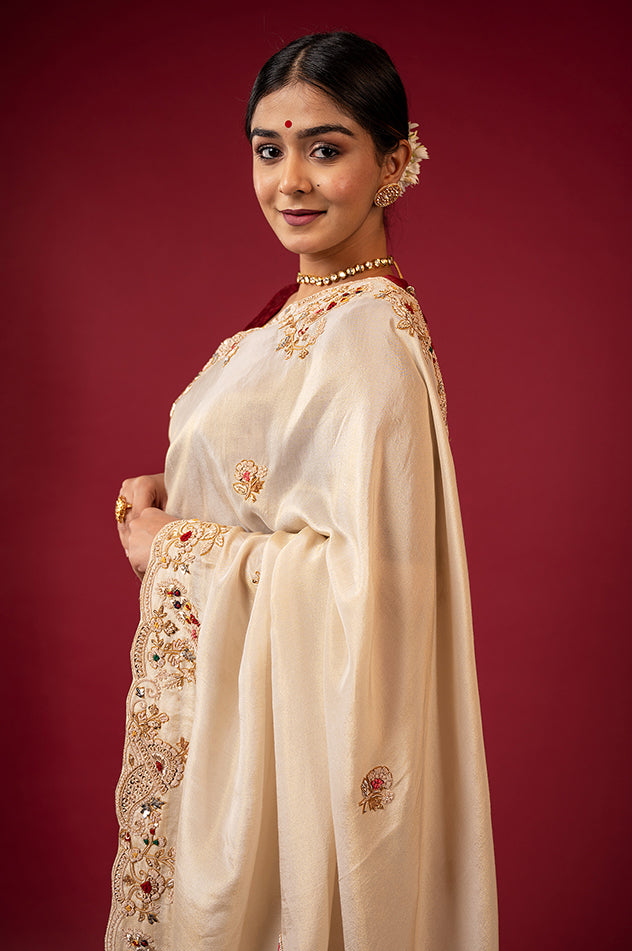 Cream pure tissue zardozi resham border butti handwork saree