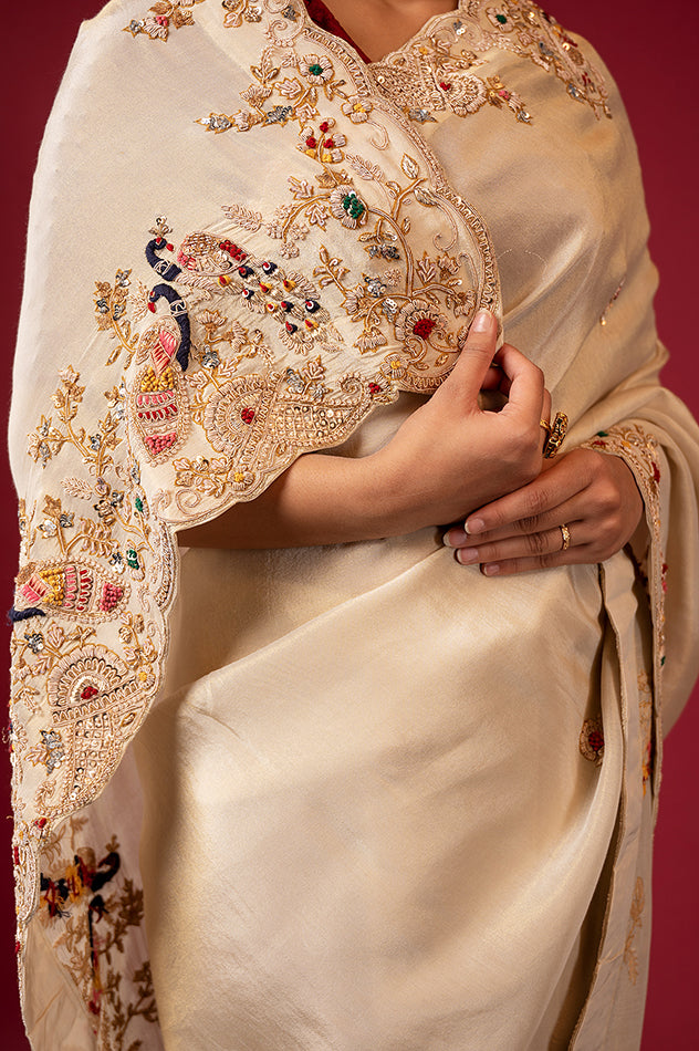 Cream pure tissue zardozi resham border butti handwork saree